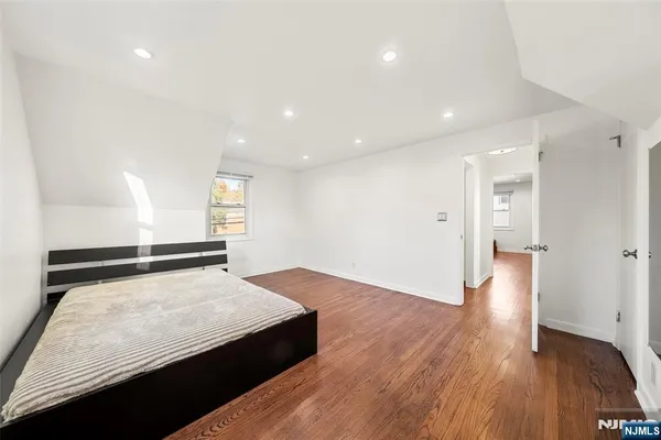 a view of a room with wooden floor