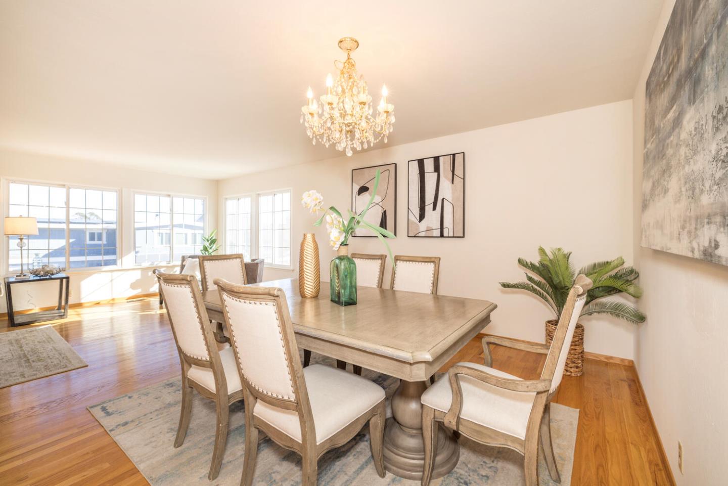 873 Morningside Drive Millbrae, CA 94030 - Photo 13 of 47 a view of a dining room with furniture and a chandelier