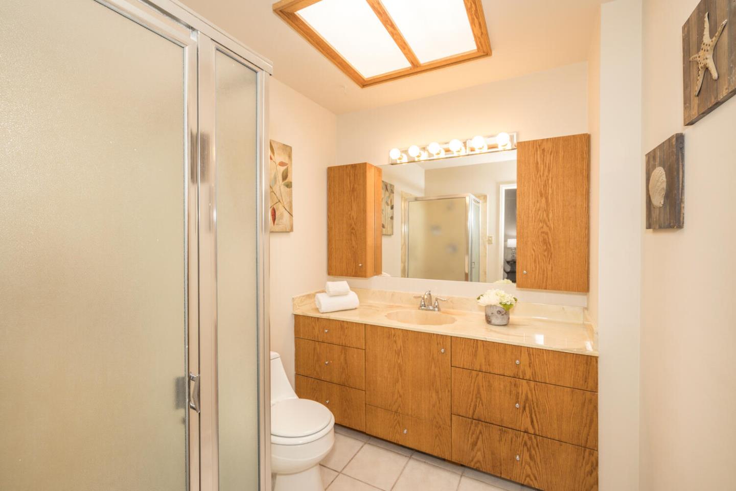 873 Morningside Drive Millbrae, CA 94030 - Photo 24 of 47 a bathroom with a sink a toilet and shower