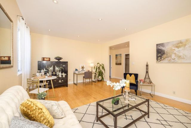 a living room with furniture and a table
