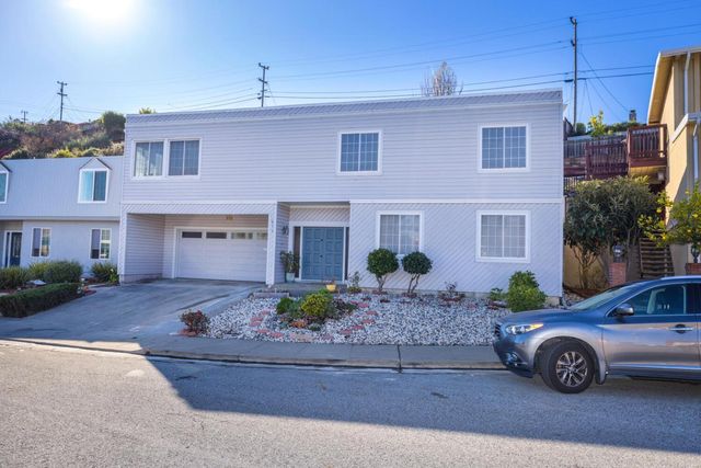 a front view of a house with garage