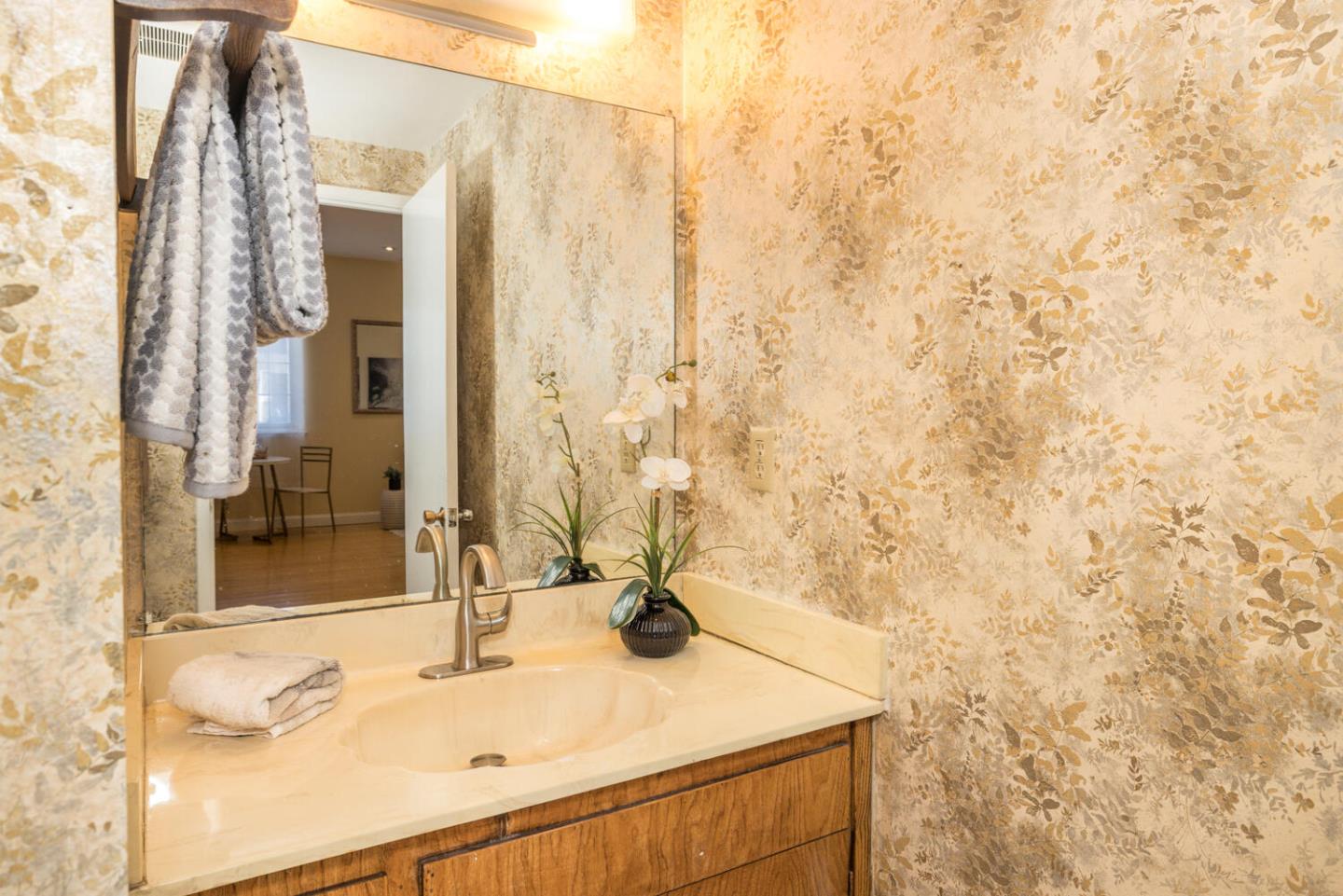 873 Morningside Drive Millbrae, CA 94030 - Photo 32 of 47 a bathroom with a sink and a mirror