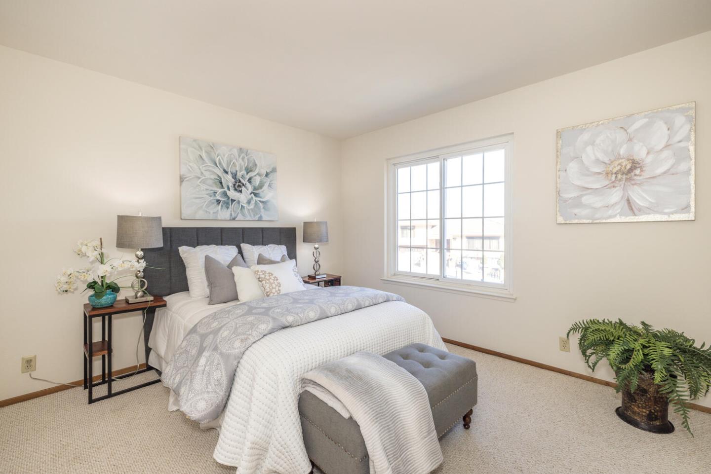 873 Morningside Drive Millbrae, CA 94030 - Photo 33 of 47 a bedroom with a bed and a painting on the wall
