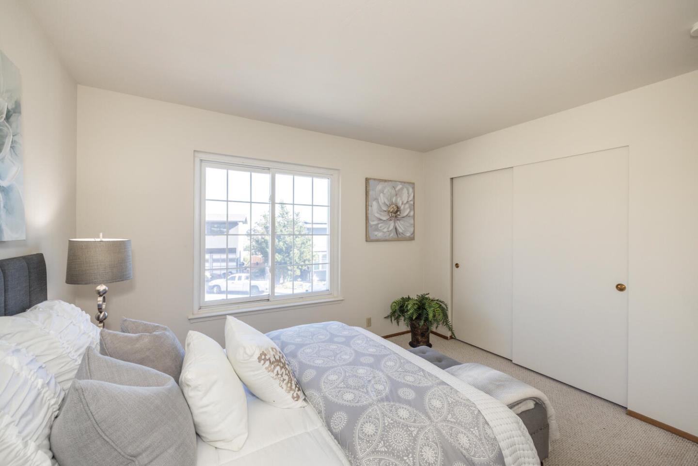 873 Morningside Drive Millbrae, CA 94030 - Photo 34 of 47 a bedroom with a bed and a window