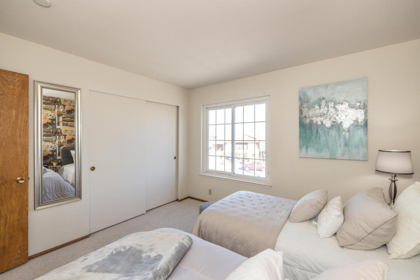 873 Morningside Drive Millbrae, CA 94030 - Photo 36 of 47 a bedroom with a bed and a painting on the wall