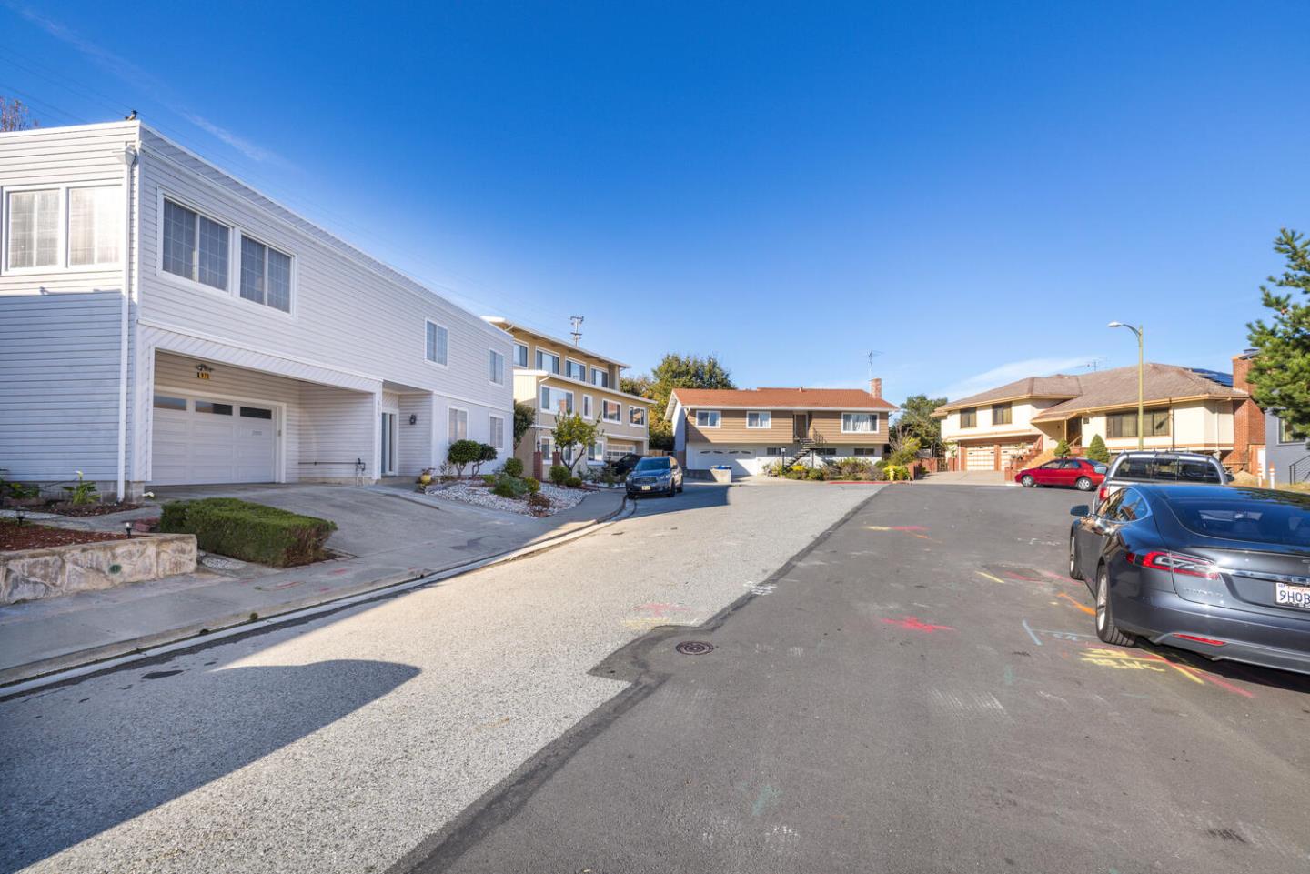 873 Morningside Drive Millbrae, CA 94030 - Photo 4 of 47 a city street lined with parked cars and buildings