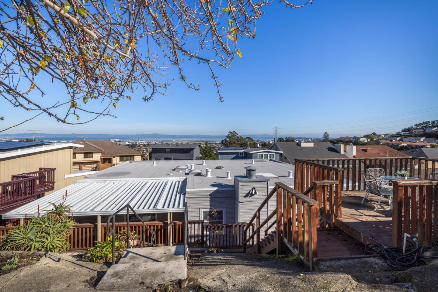 873 Morningside Drive Millbrae, CA 94030 - Photo 42 of 47 a view of a patio with table and chairs with wooden floor and fence