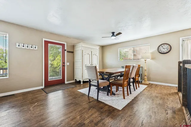 a view of a livingroom with furniture window and wooden floor