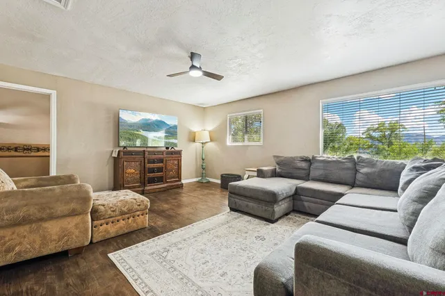 a living room with furniture and a large window