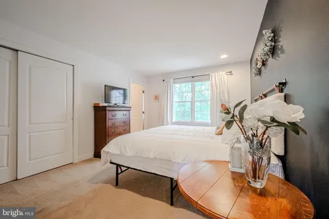 a view of a livingroom with furniture and a window