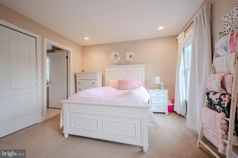 a bedroom with a bed and a closet