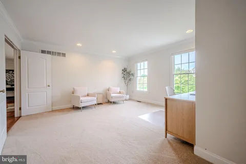 a view of a room with a window and a couch