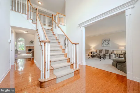 a view of a livingroom with furniture and stairs
