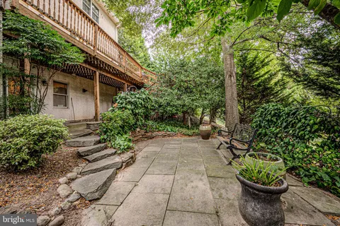 a backyard of a house with lots of green space