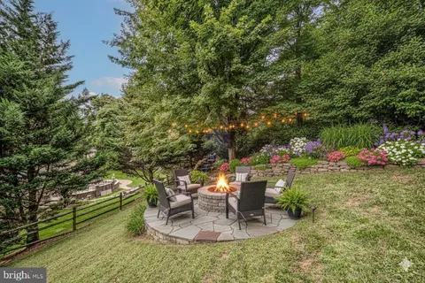 a backyard of a house with outdoor seating