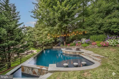 a view of a house with a yard from a tub