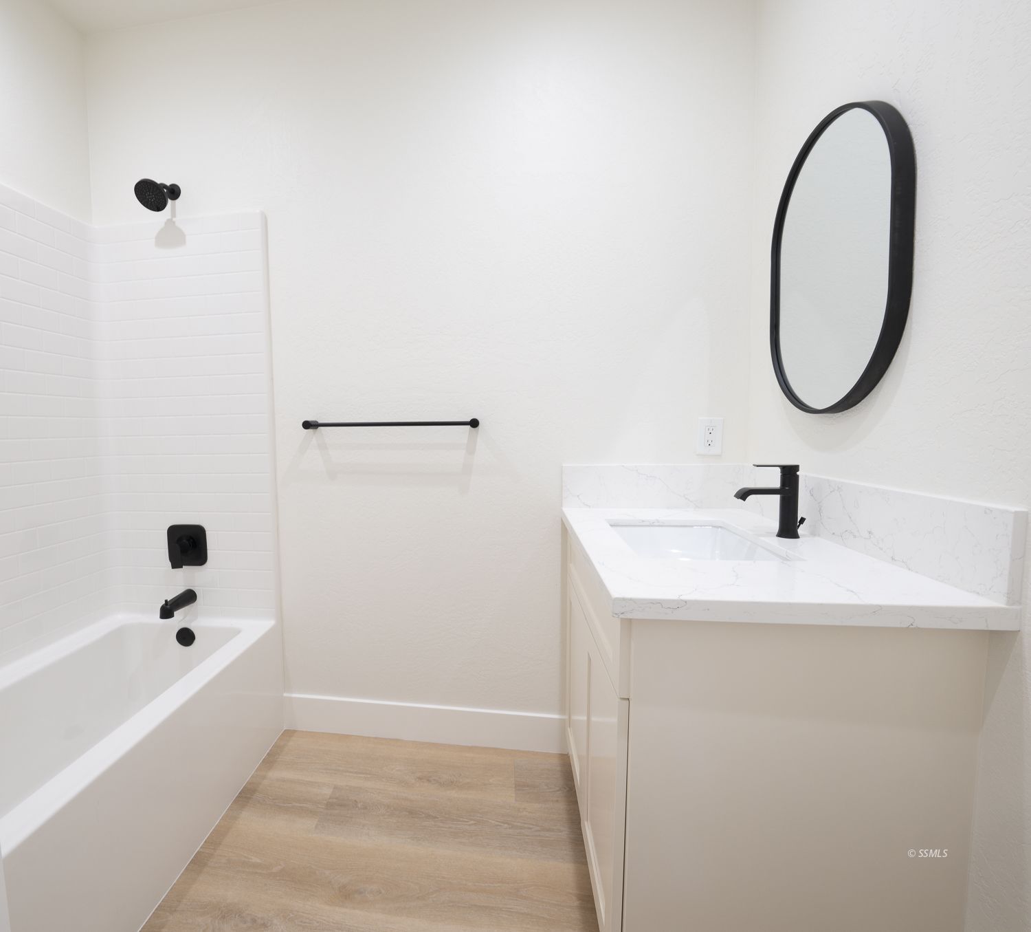 1528 Mayo Street Ridgecrest, CA 93555 - Photo 24 of 34 a bathroom with a sink a bathtub and a mirror
