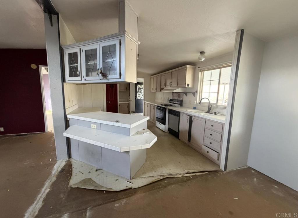 1638 Calavo Road, Unit 63 Fallbrook, CA 92028 - Photo 2 of 9 a living room with a sink furniture and a window