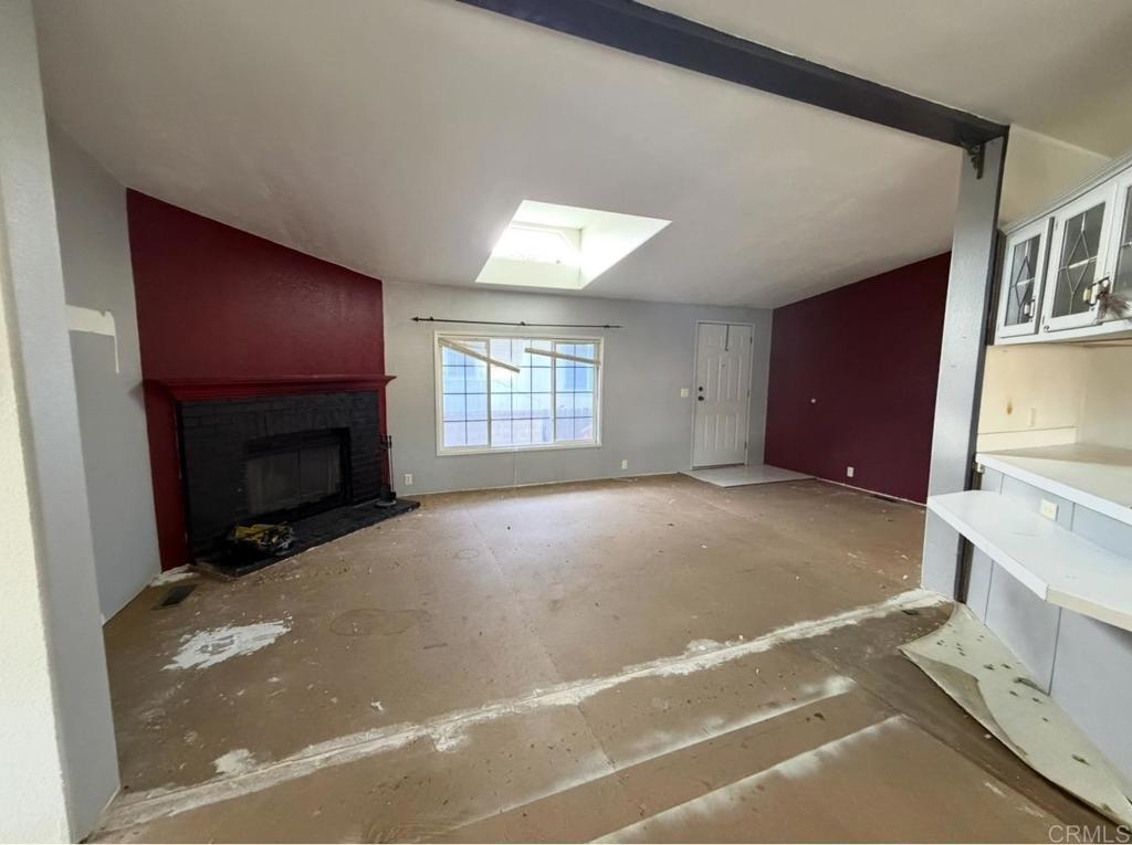 1638 Calavo Road, Unit 63 Fallbrook, CA 92028 - Photo 4 of 9 a view of empty room with a fireplace