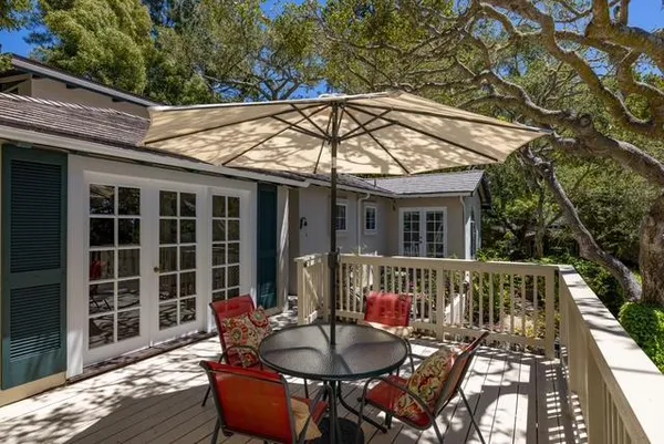 a patio with a table and chairs