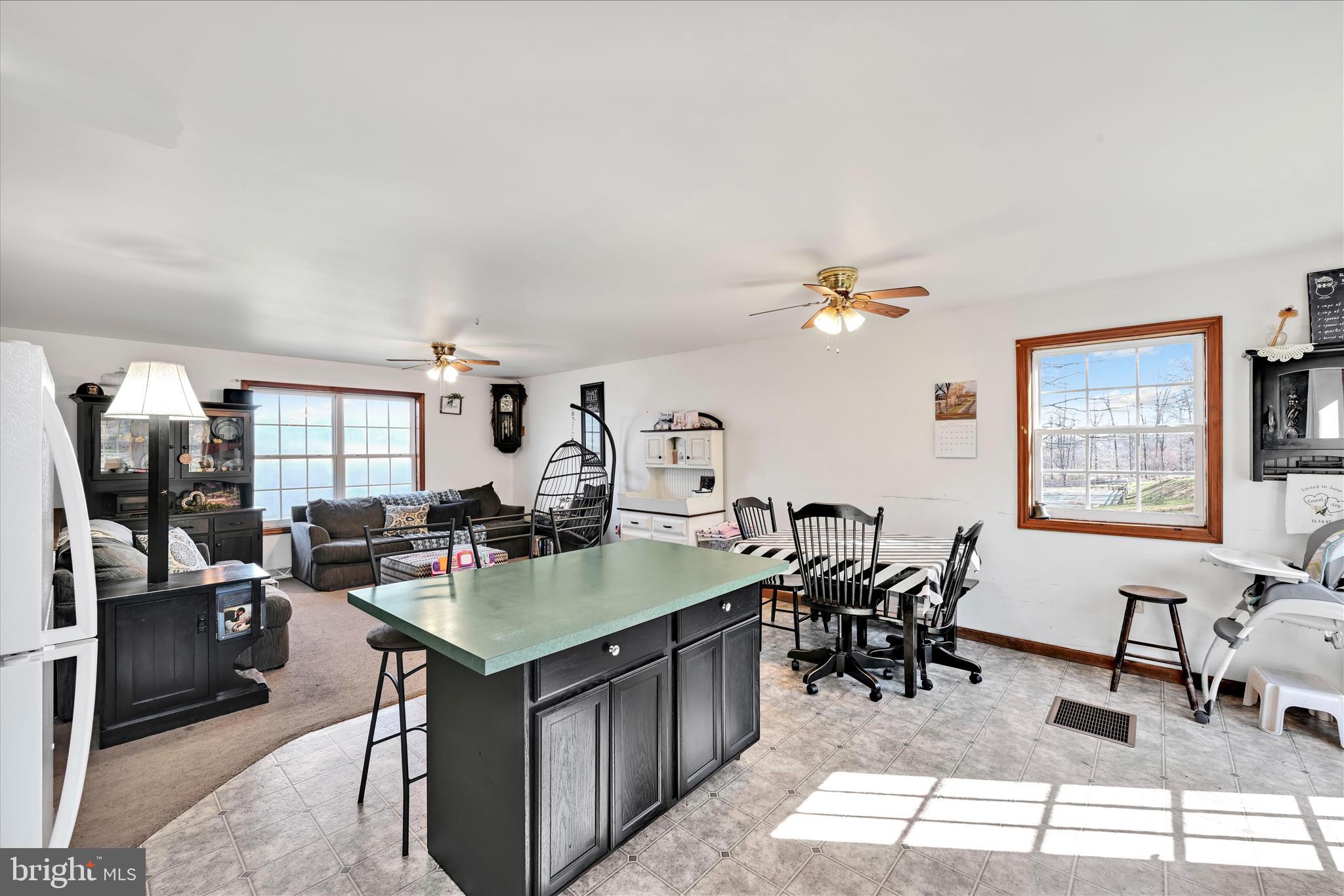 411 Red Hill Road Pequea, PA 17565 - Photo 19 of 50 a view of a kitchen counter space dining table and chairs