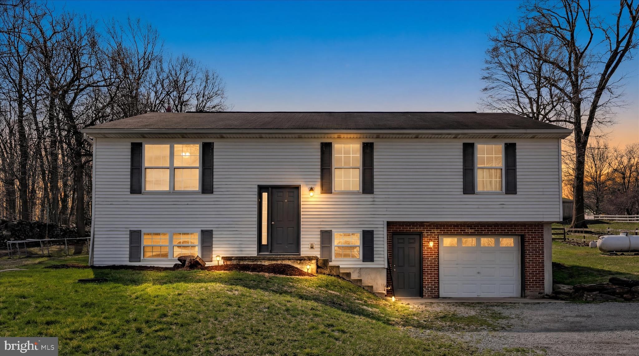 411 Red Hill Road Pequea, PA 17565 - Photo 2 of 50 a front view of a house with a yard