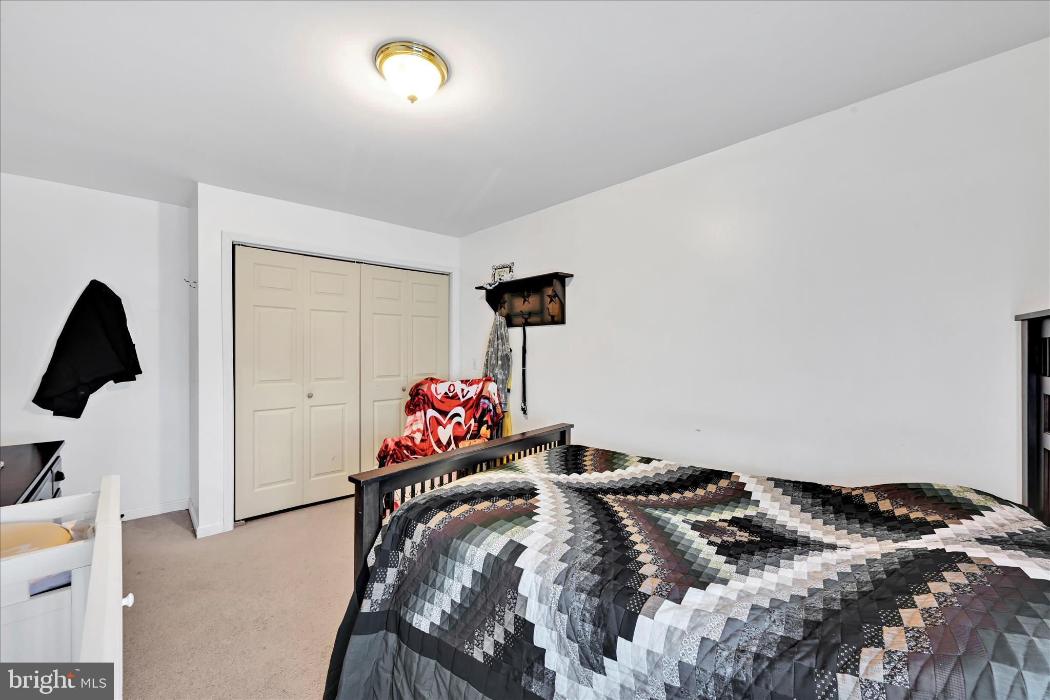 411 Red Hill Road Pequea, PA 17565 - Photo 22 of 50 a bedroom with a bed and a window