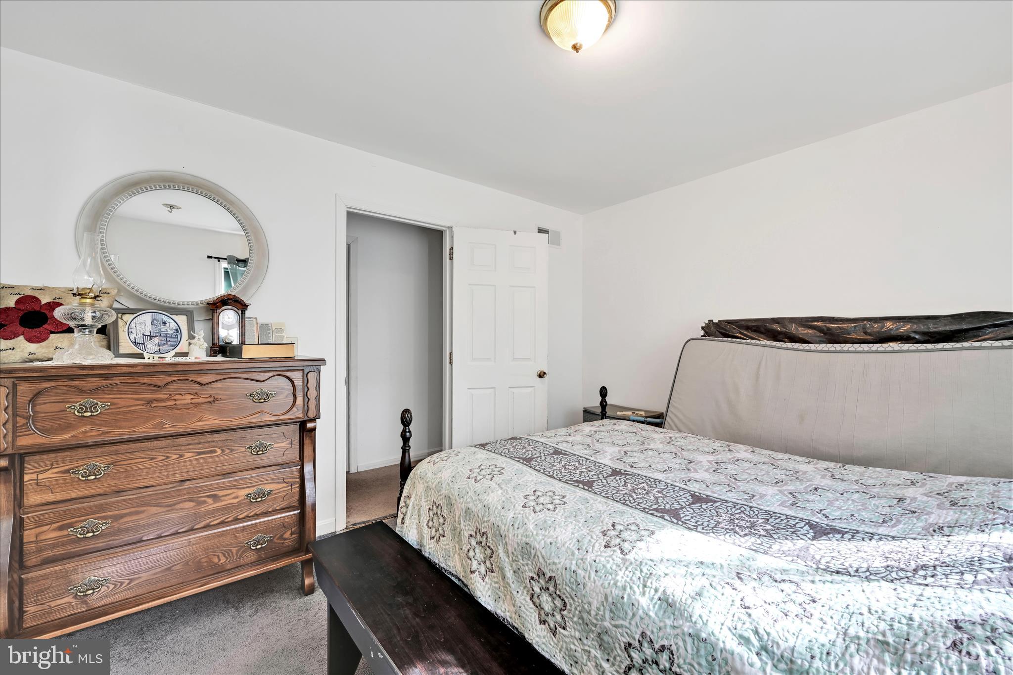 411 Red Hill Road Pequea, PA 17565 - Photo 25 of 50 a bedroom with a bed and a dresser