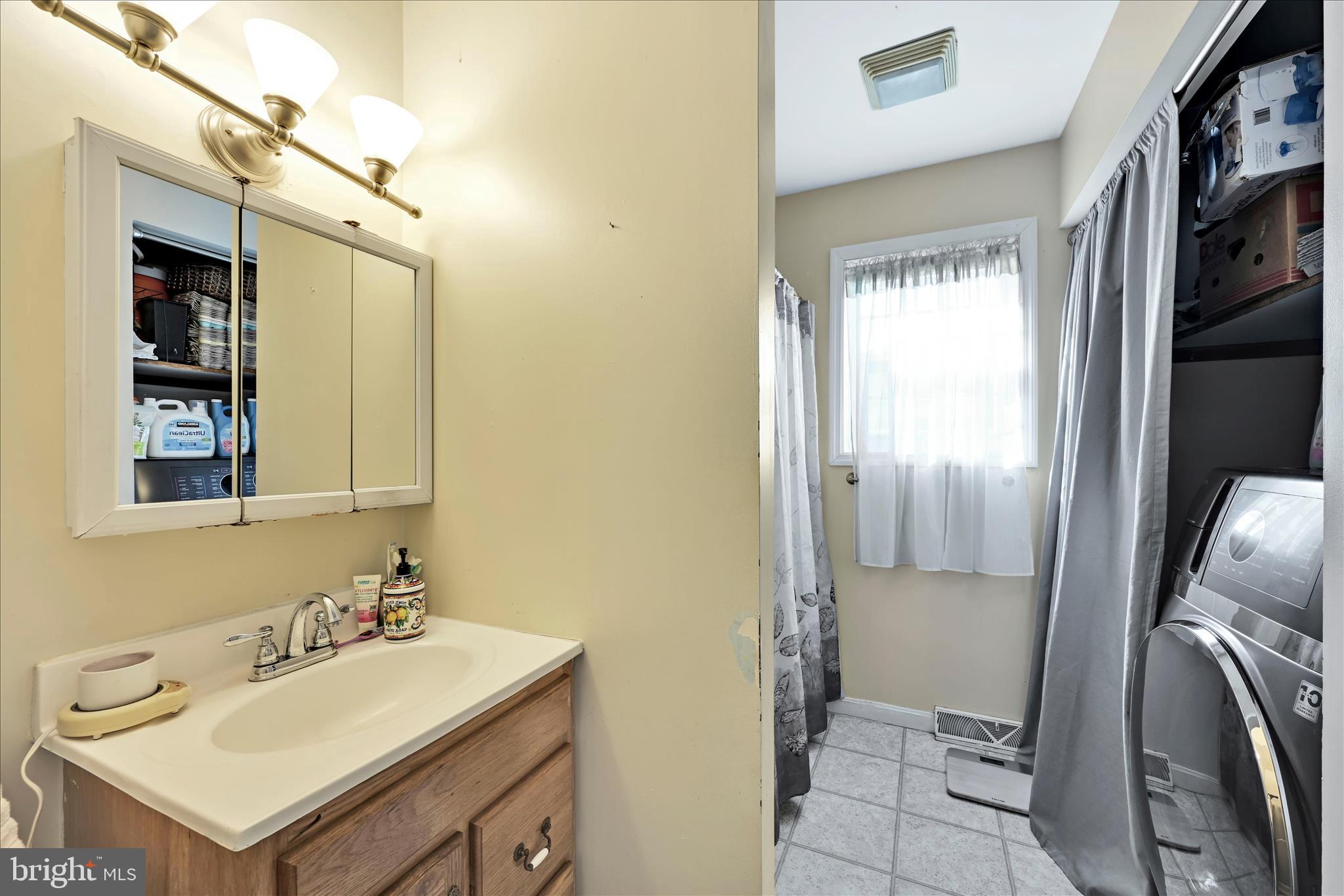 411 Red Hill Road Pequea, PA 17565 - Photo 27 of 50 a bathroom with a sink vanity and a mirror