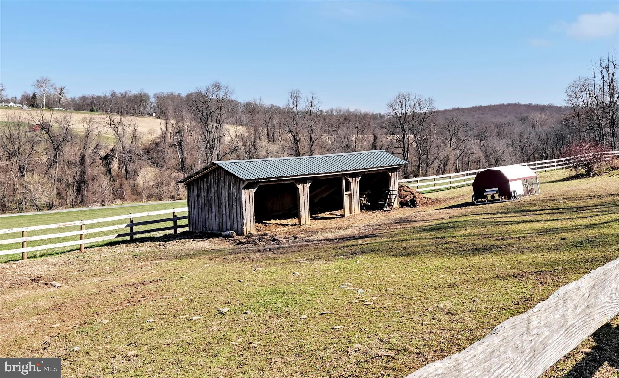 411 Red Hill Road Pequea, PA 17565 - Photo 42 of 50 a view of a house with a swimming pool