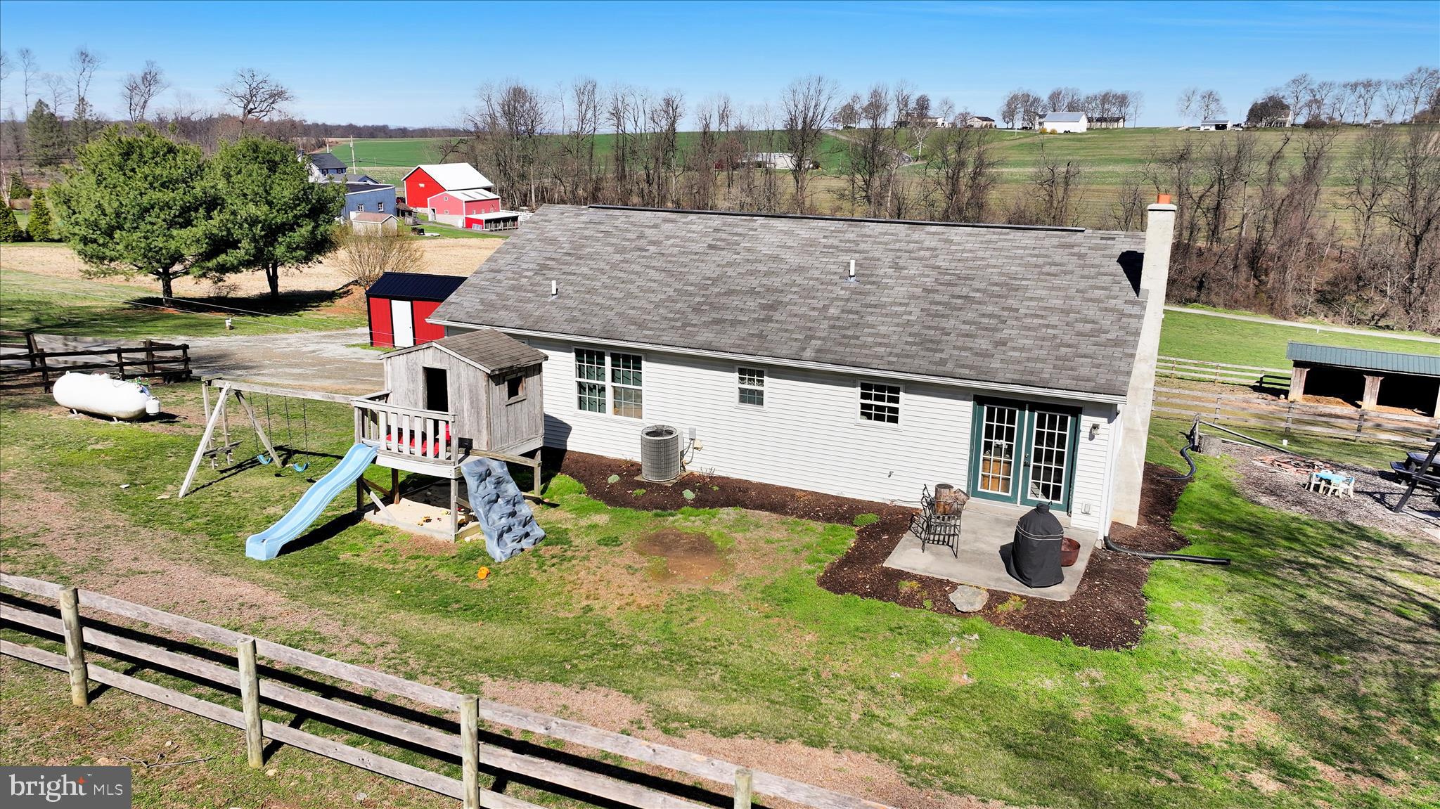 411 Red Hill Road Pequea, PA 17565 - Photo 5 of 50 an aerial view of a house with swimming pool and big yard