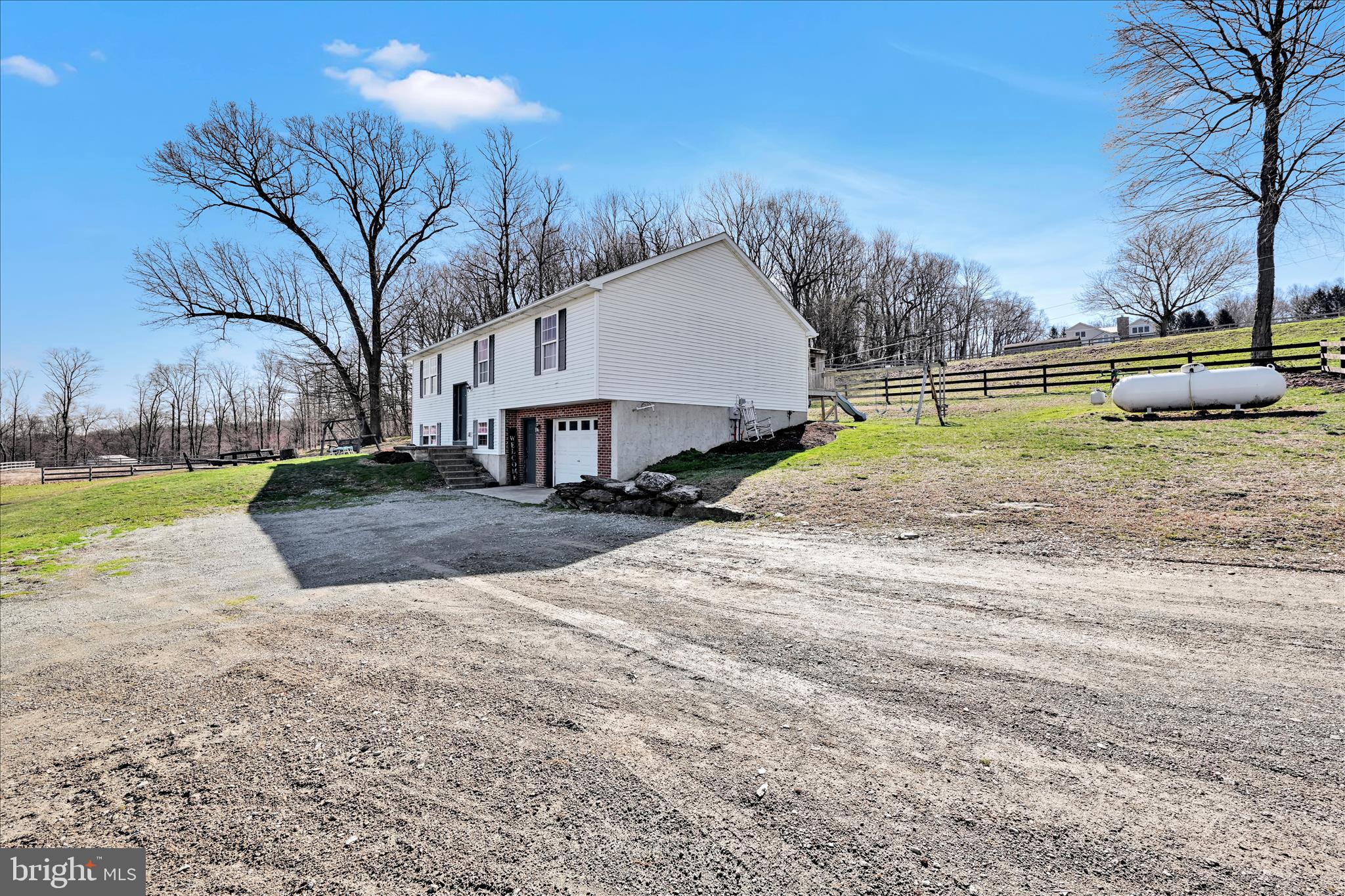 411 Red Hill Road Pequea, PA 17565 - Photo 7 of 50 a view of a yard with a house and trees