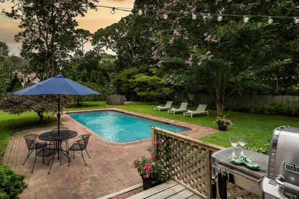 an outdoor space with furniture and umbrella