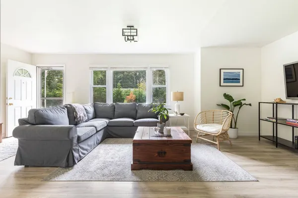 a living room with furniture and a large window
