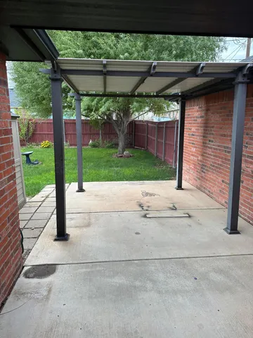 a view of backyard and tree