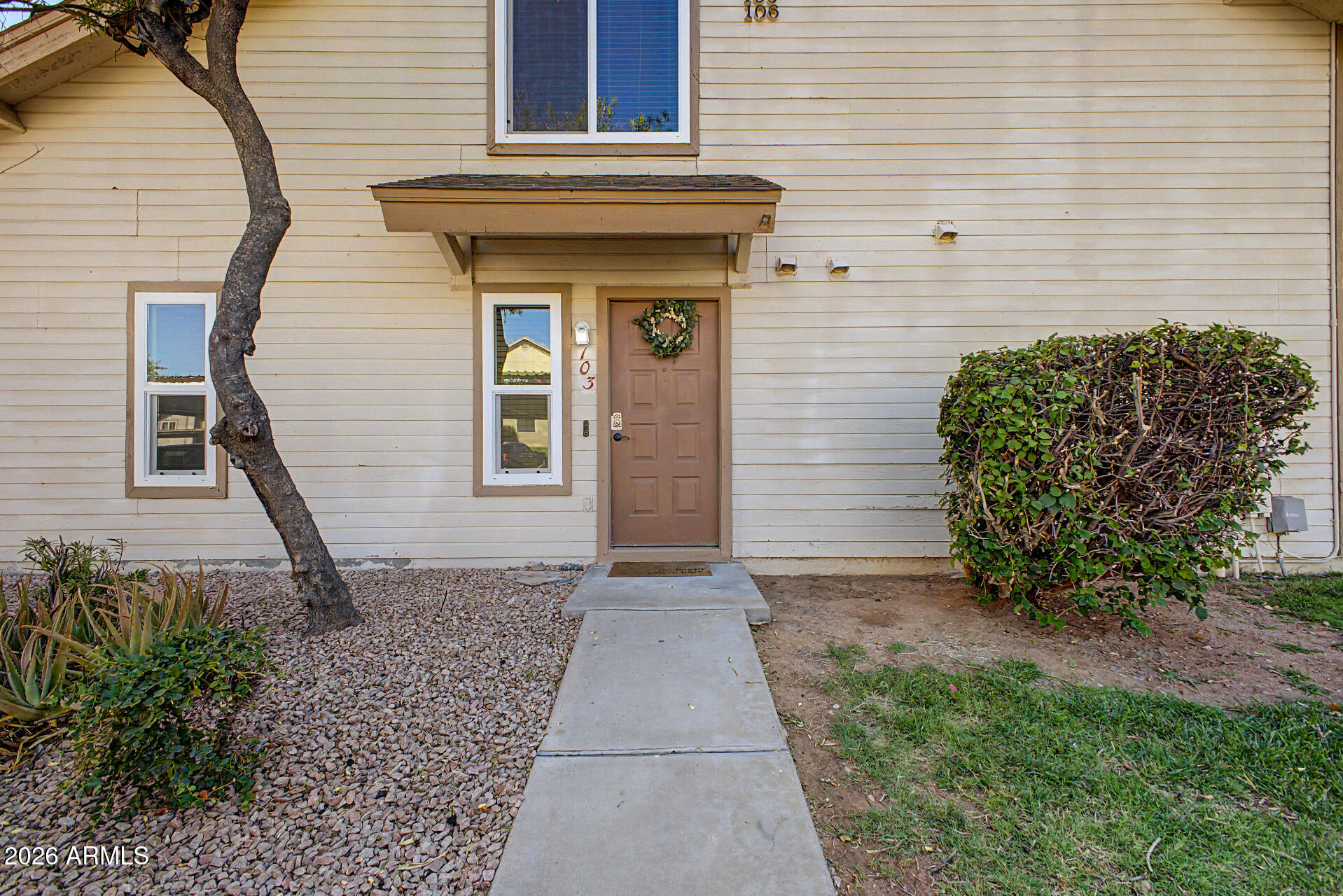 2455 East Broadway Road, Unit 103 Mesa, AZ 85204 - Photo 3 of 22 a front view of a house