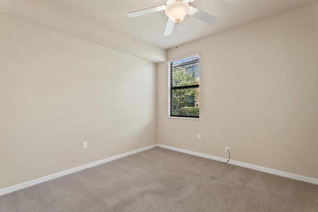20080 Ragazza Circle, Unit 102 Venice, FL 34293 - Photo 27 of 49 an empty room with a window