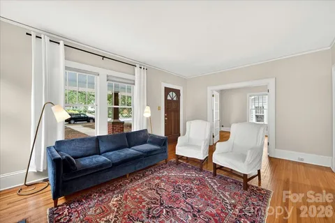 a living room with furniture and a rug