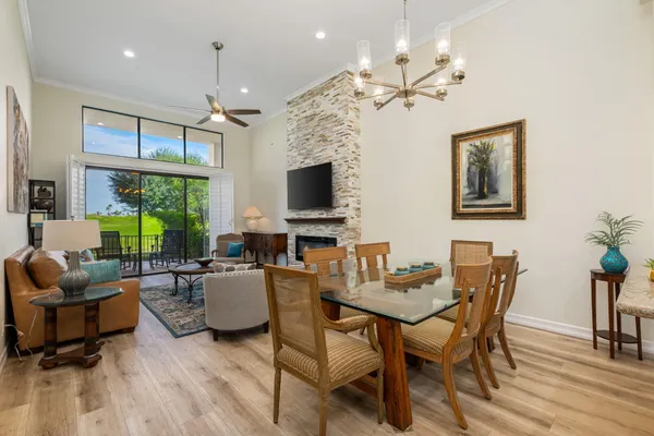 a view of a livingroom with furniture window and wooden floor