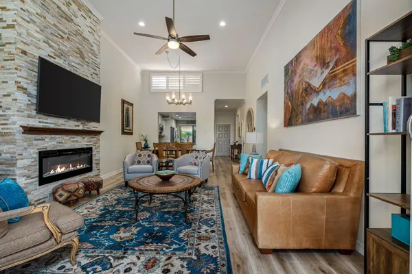 a living room with fireplace furniture and a flat screen tv