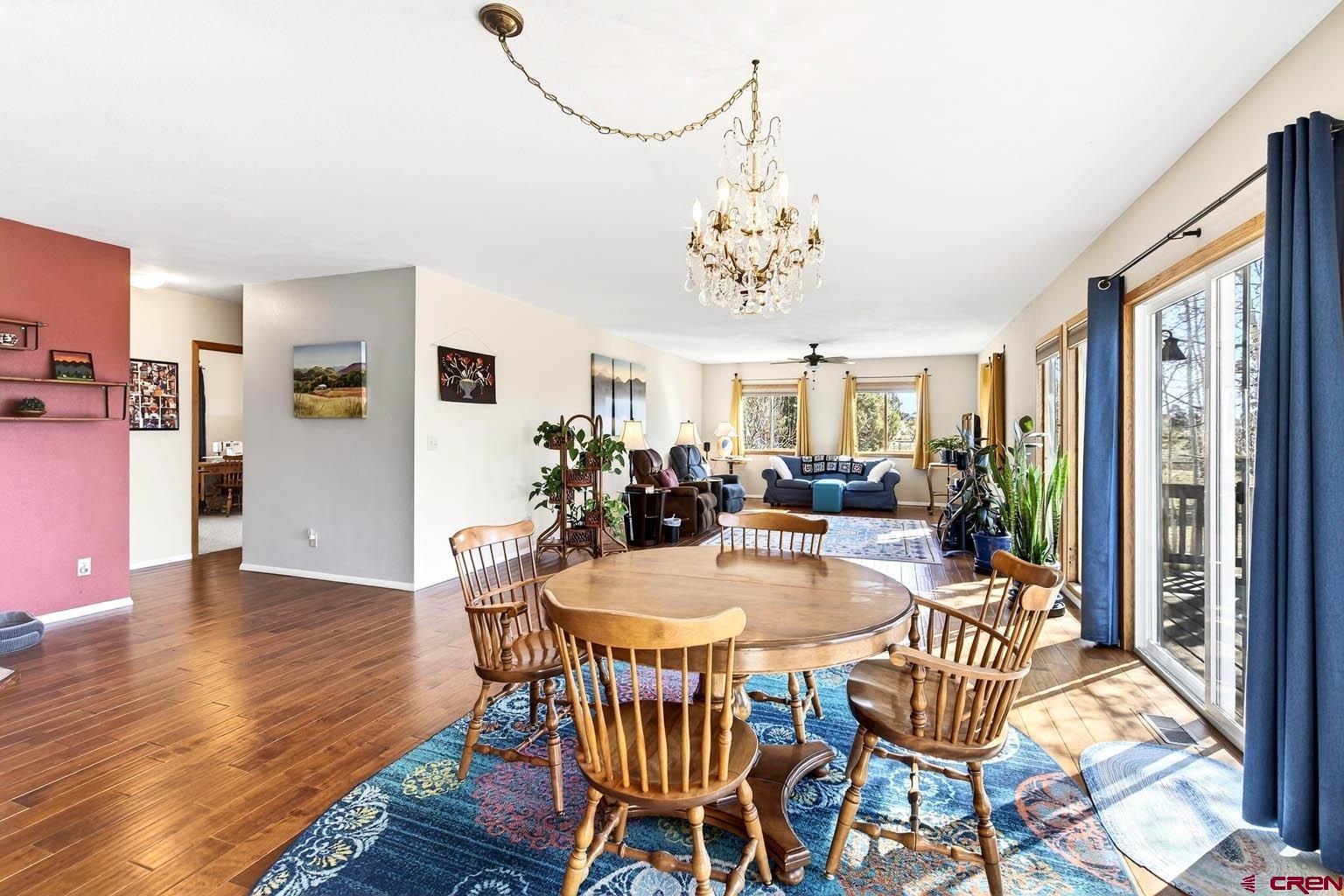 23360 Rd T Dolores, CO 81323 - Photo 12 of 45 a view of a dining room with furniture window and wooden floor
