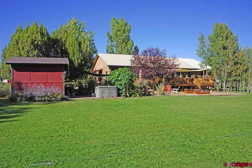 23360 Rd T Dolores, CO 81323 - Photo 37 of 45 a view of a house with a yard and potted plants