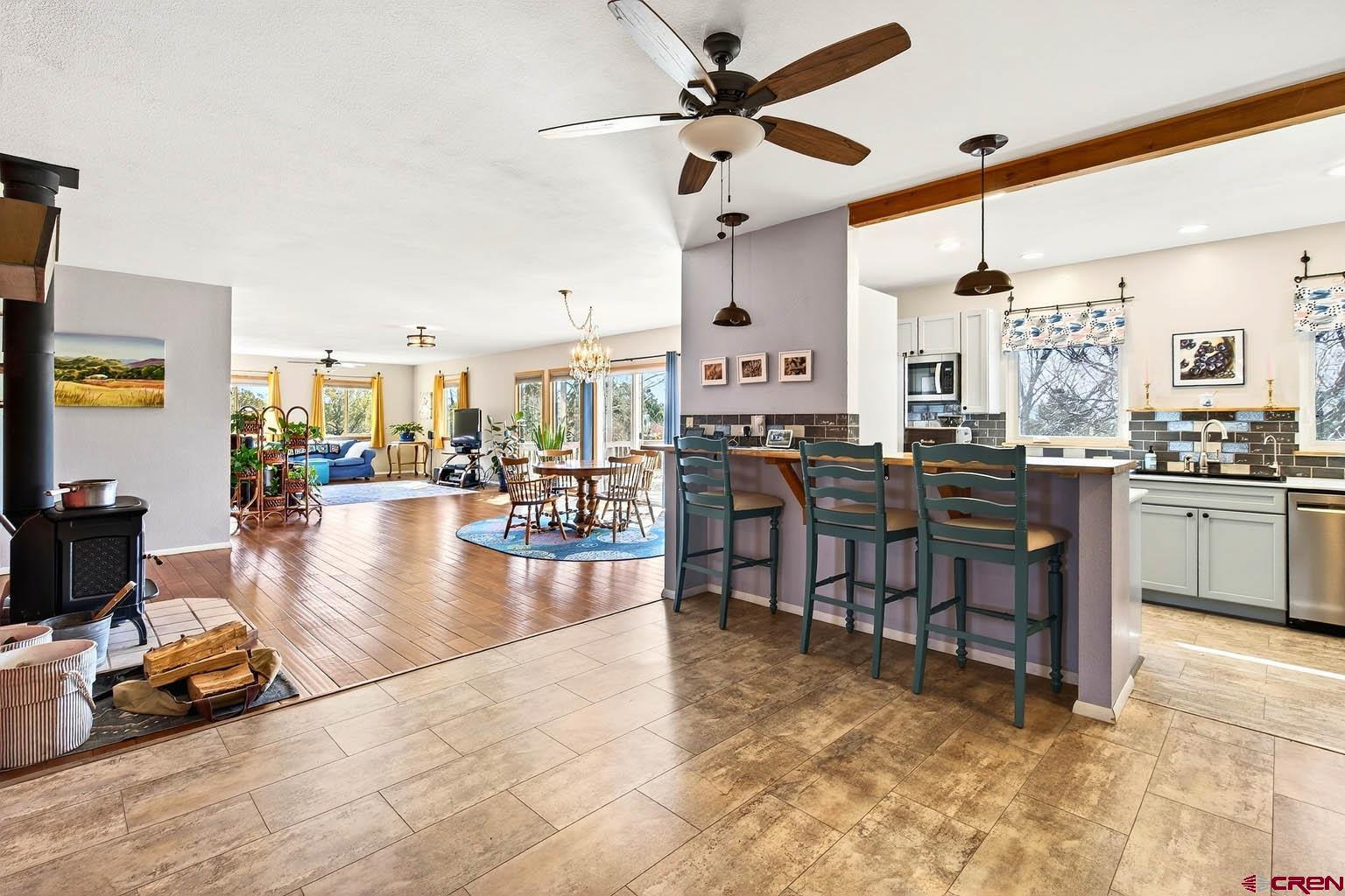 23360 Rd T Dolores, CO 81323 - Photo 10 of 45 a living room with lots of furniture and kitchen view