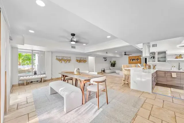 a kitchen with a sink and a refrigerator