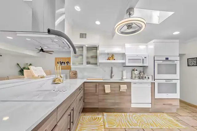 a bedroom with a bed and a potted plant