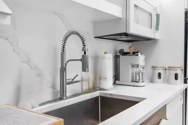 a bathroom with a sink toilet a mirror and shower