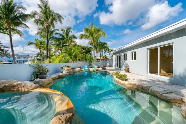 a wooden bench sitting in front of a building