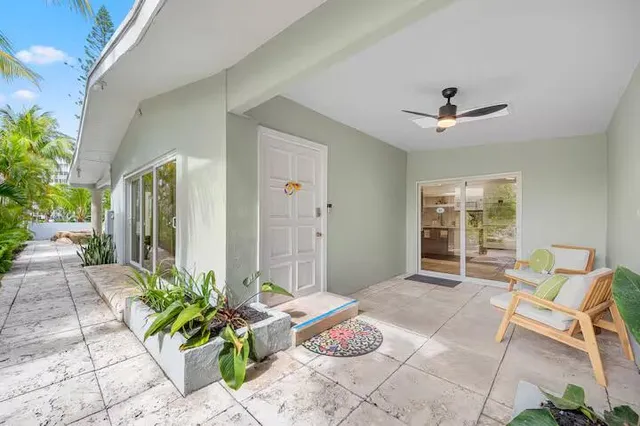a dining room with furniture a rug and a chandelier
