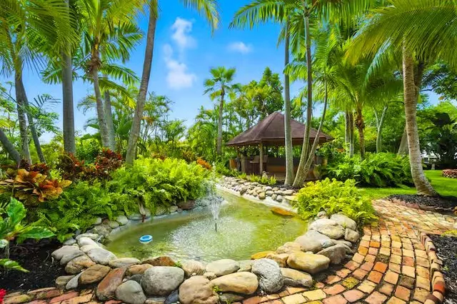 a view of yard with swimming pool and trees