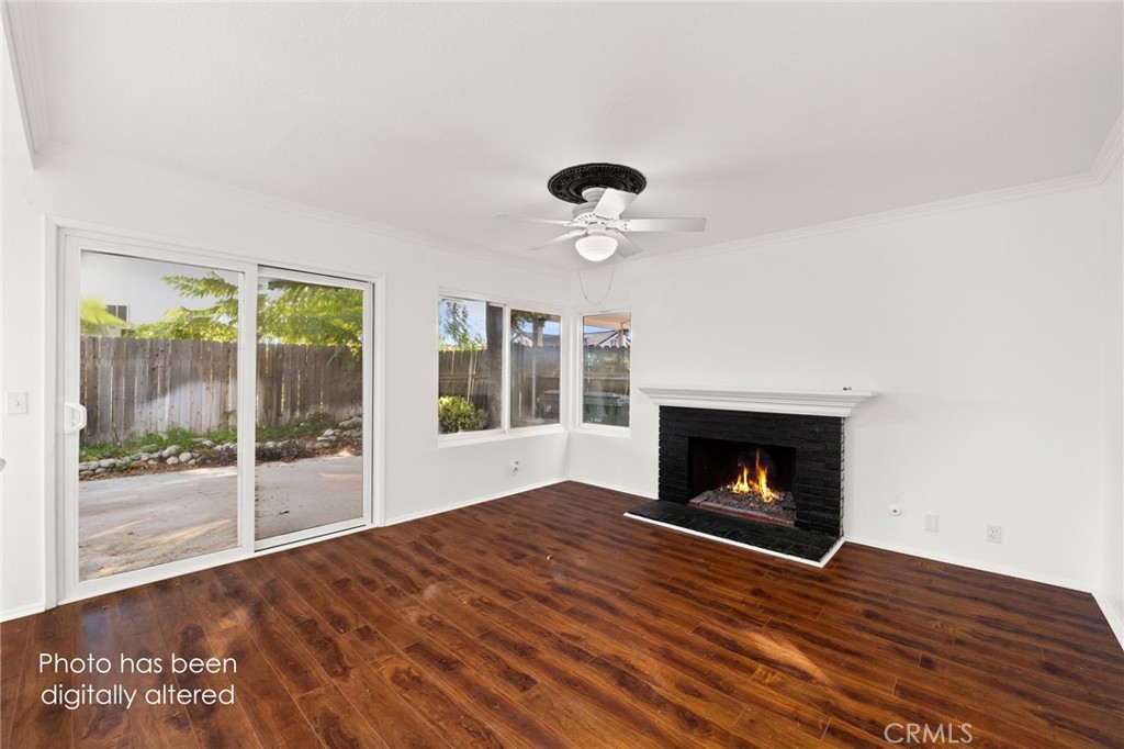 8985 Sage Drive Rancho Cucamonga, CA 91701 - Photo 10 of 49 This family room is a perfect space to gather around the fireplace!